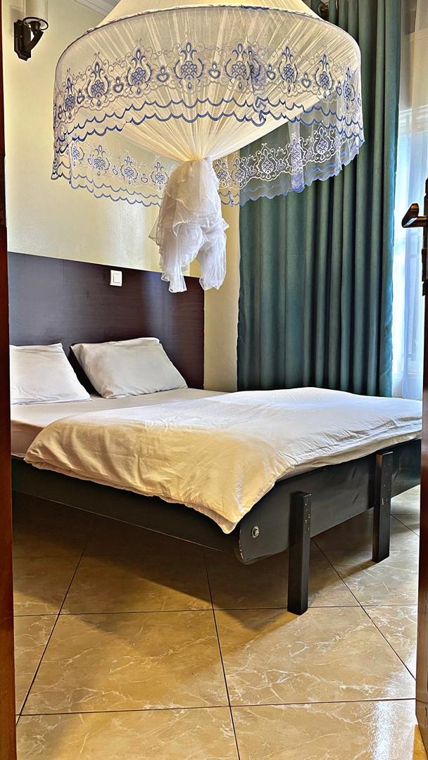 Bedroom with mosquito net in Rubaga KD 1